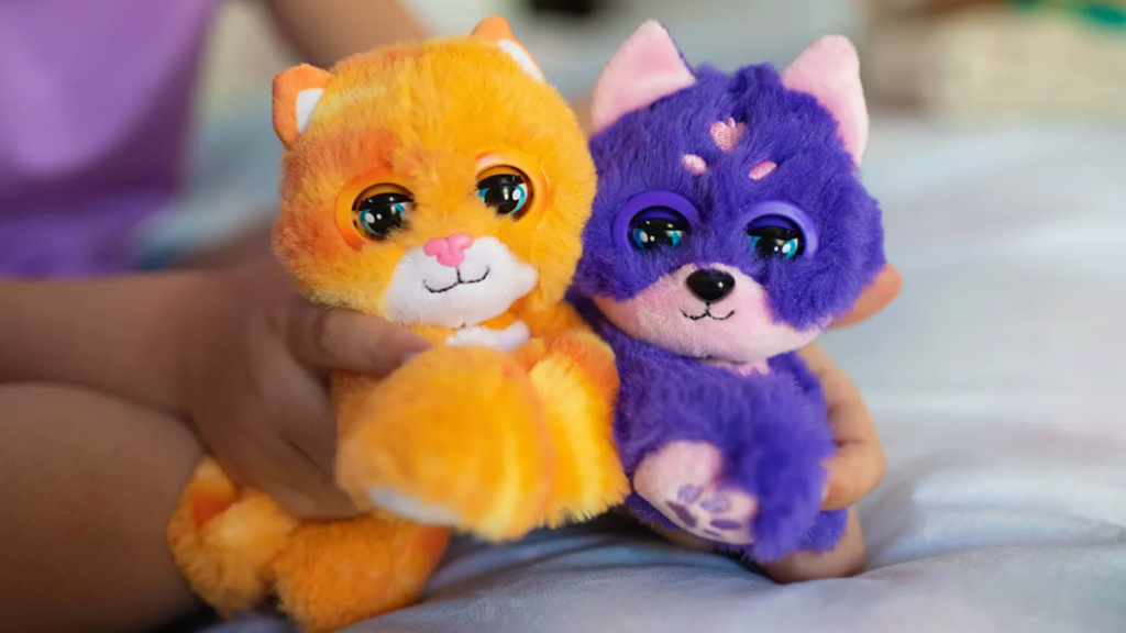 A child playing with two Nuzzy Luvs